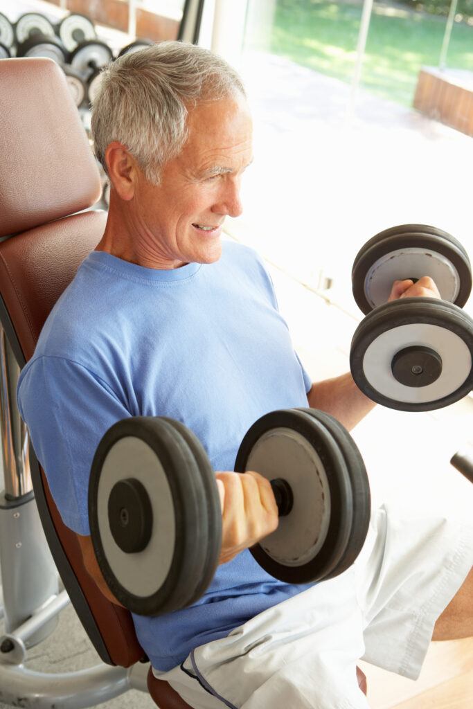 senior with dumbbells